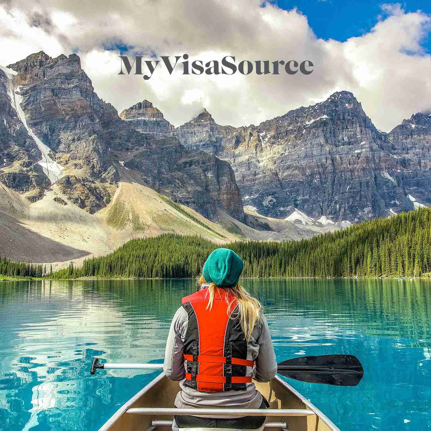 canoeing in a beautiful lake with a mountain view my visa source