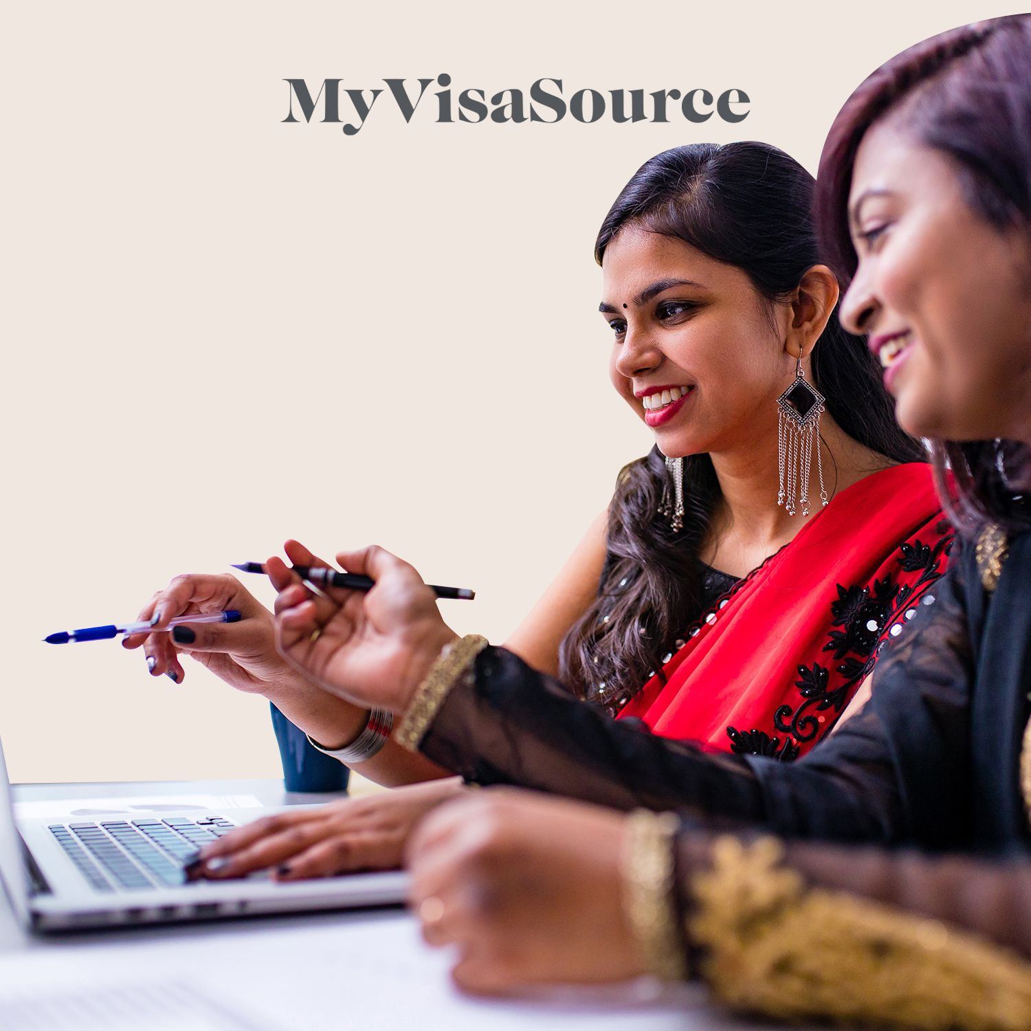 east indian business women in front of a laptop my visa source