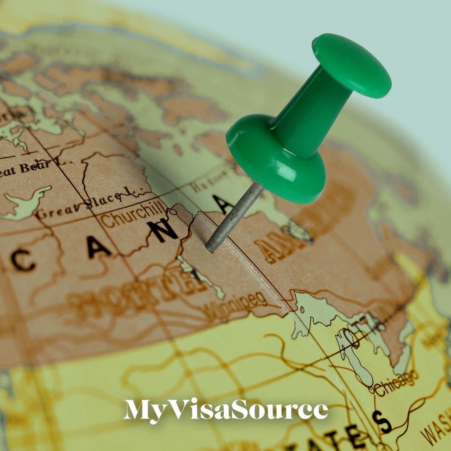 globe with a green pin on canada my visa source