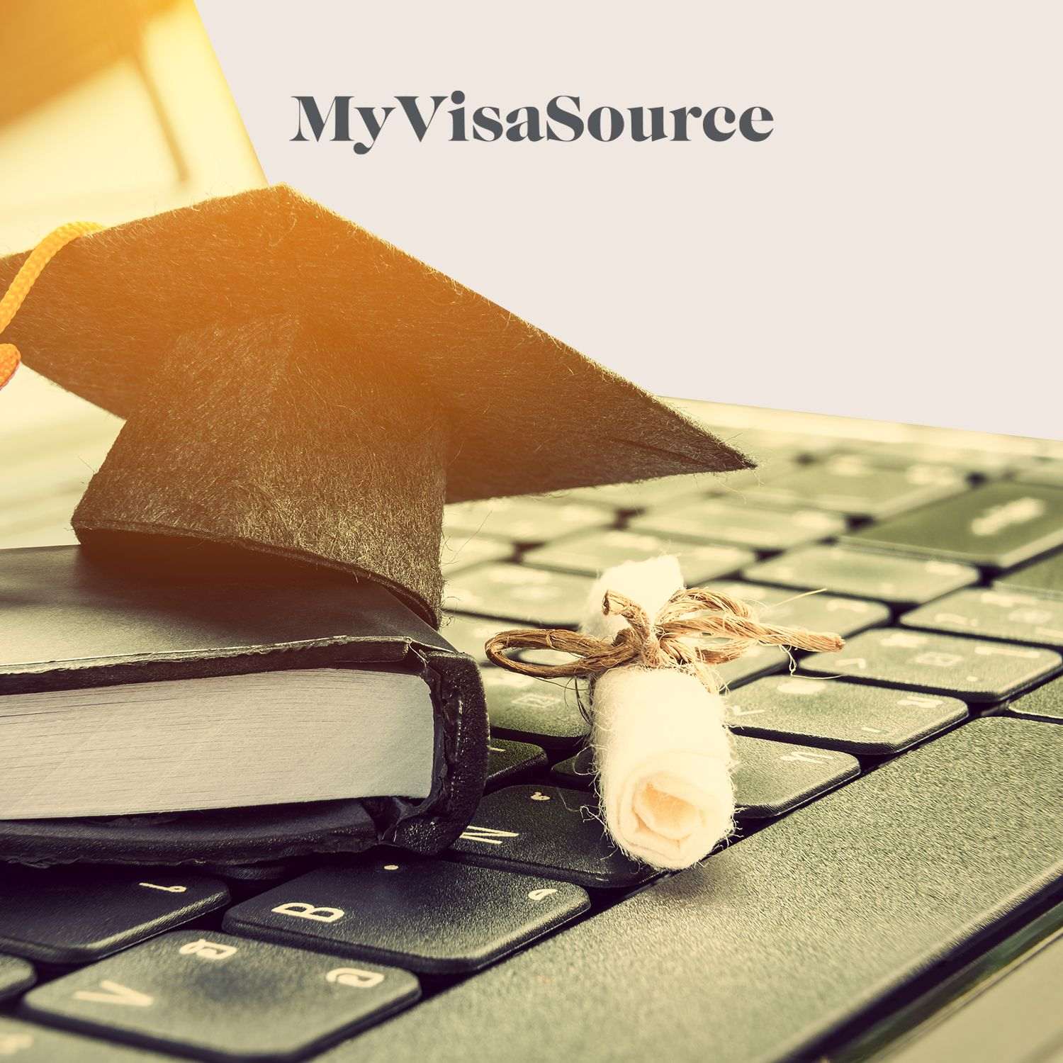 graduation items on laptop keyboard my visa source