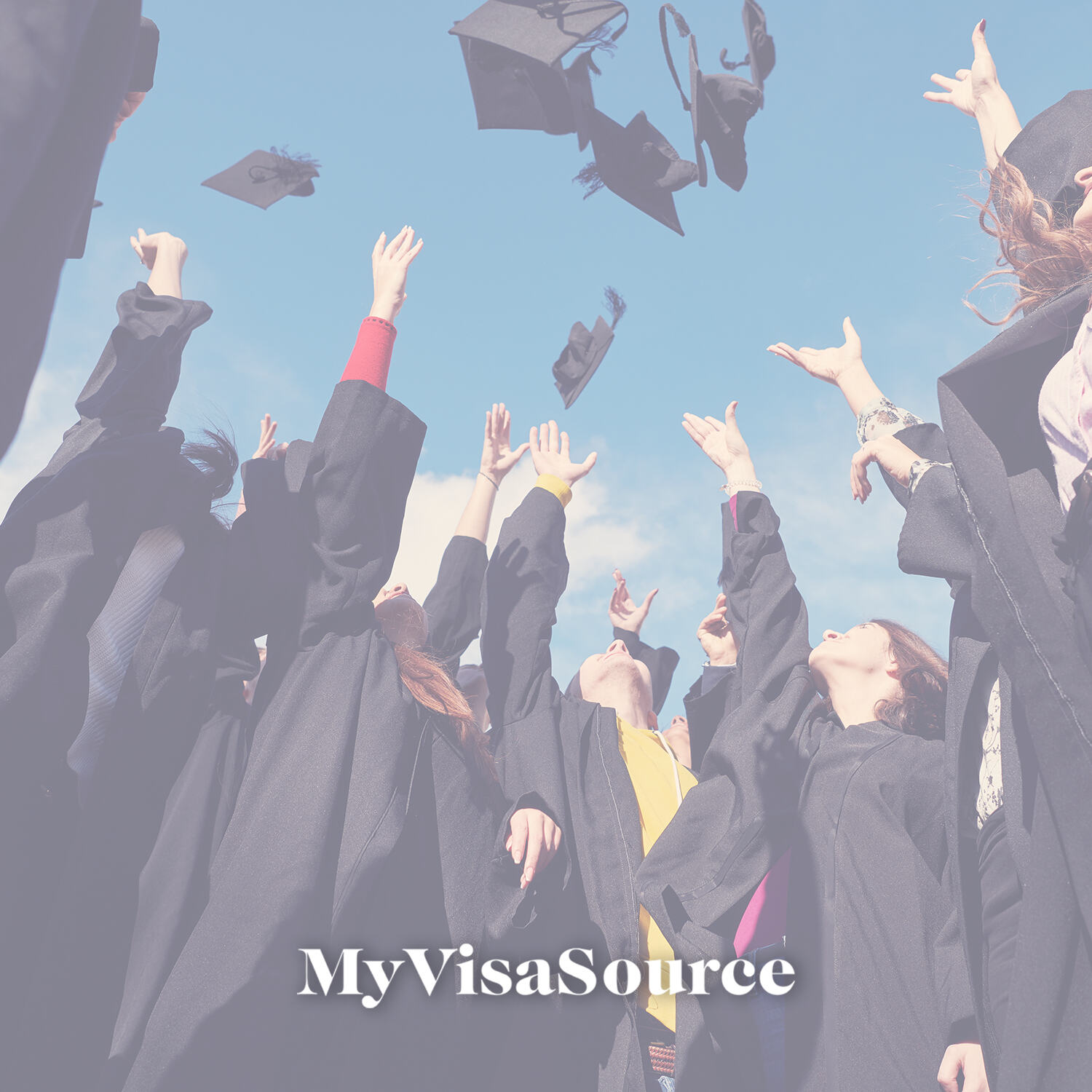 group of graduates throwing hats in the air