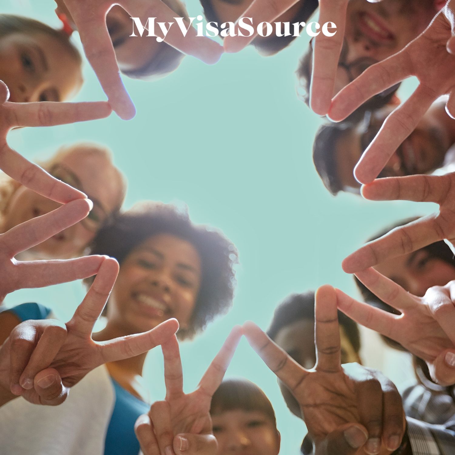 group of students all with fingers in a piece symbol my visa source