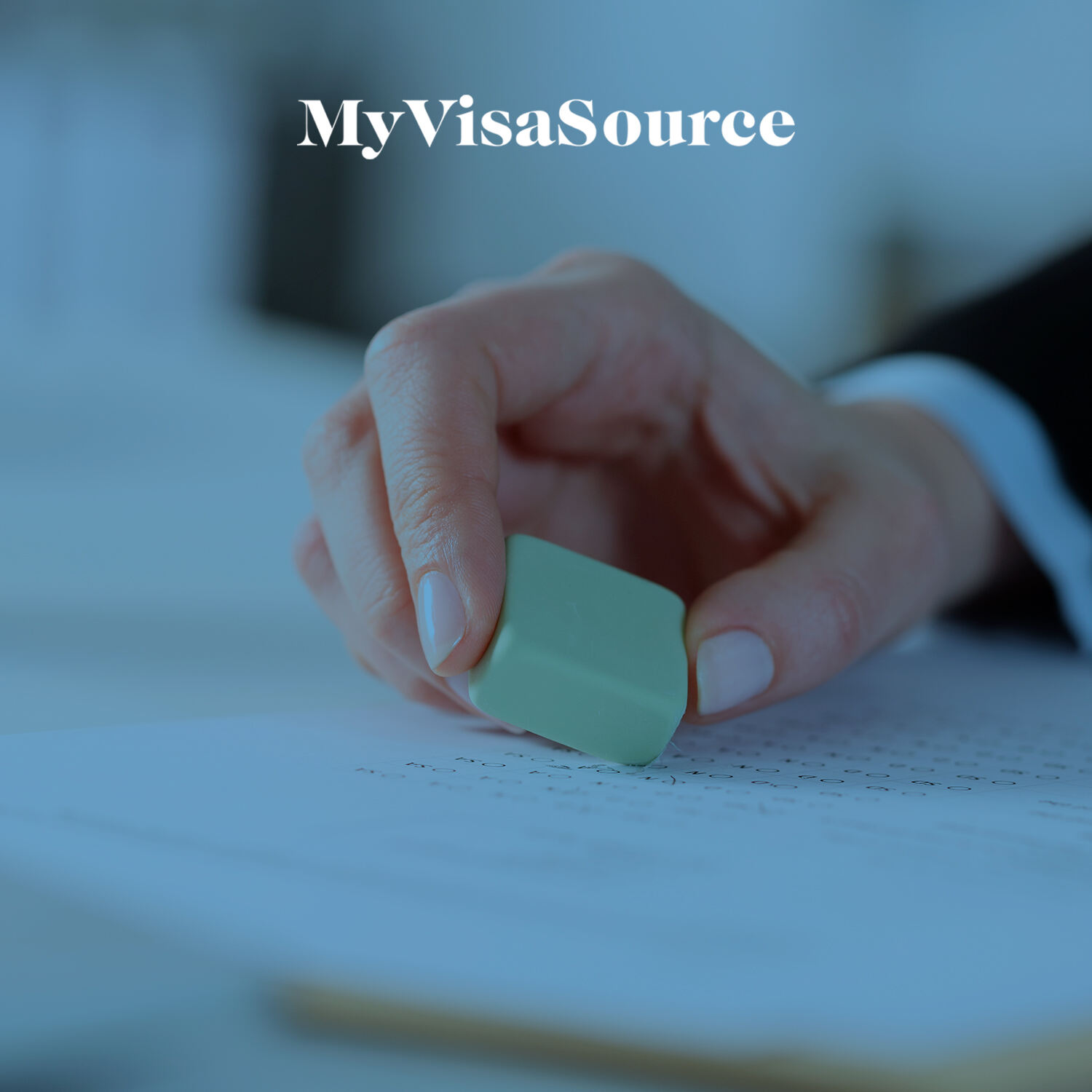 hand holding an eraser changing a document my visa source