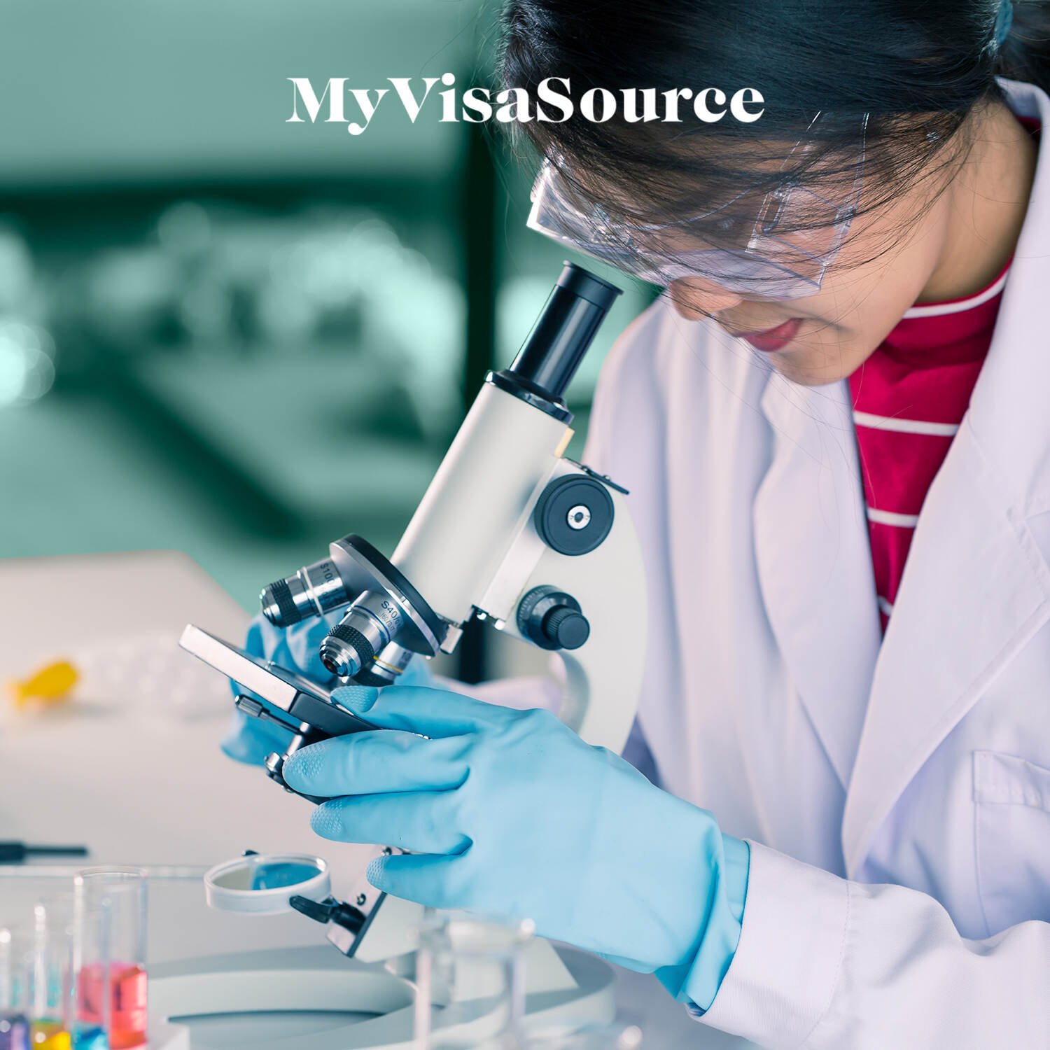 medical technician working over microscope my visa source