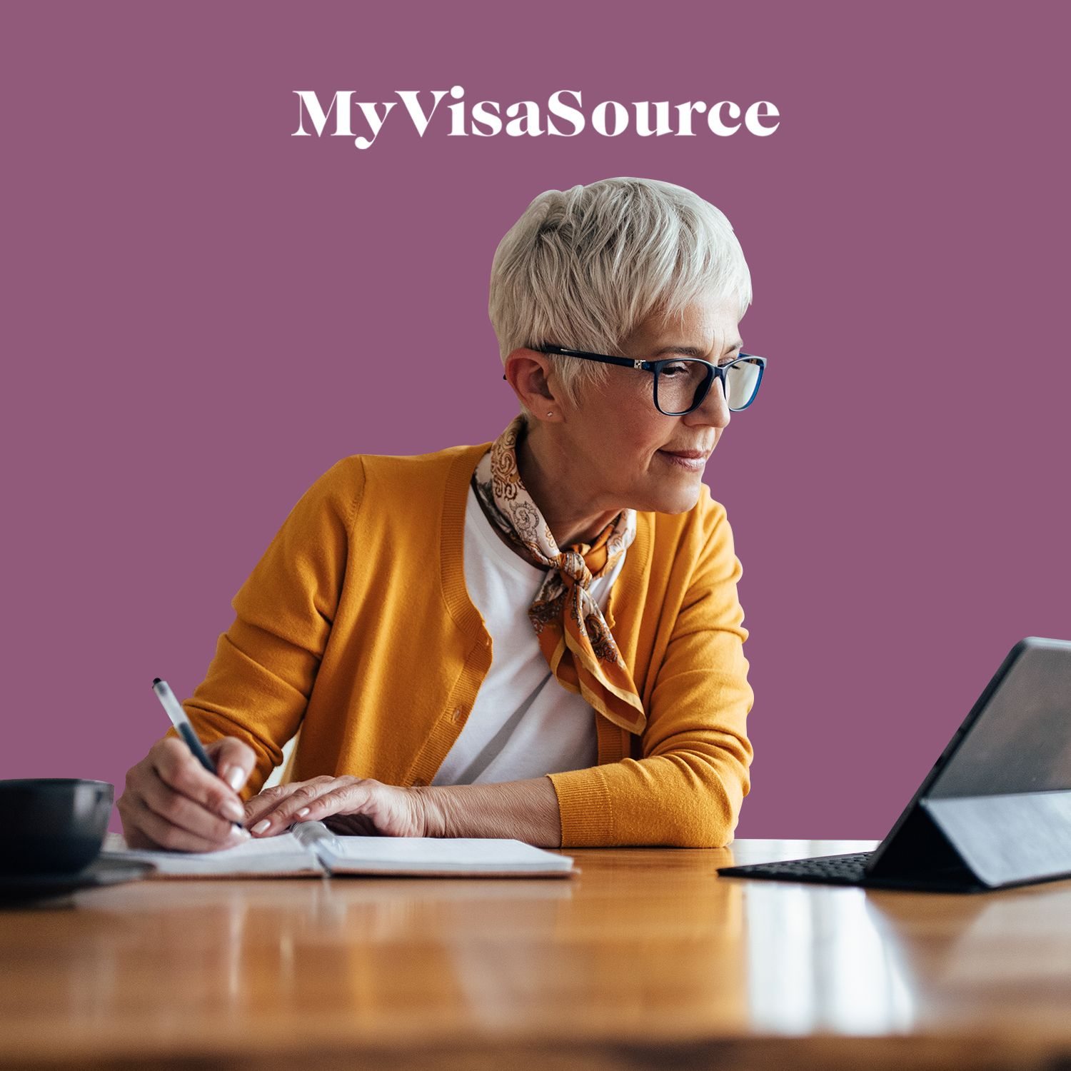 older professional woman taking notes from laptop my visa source