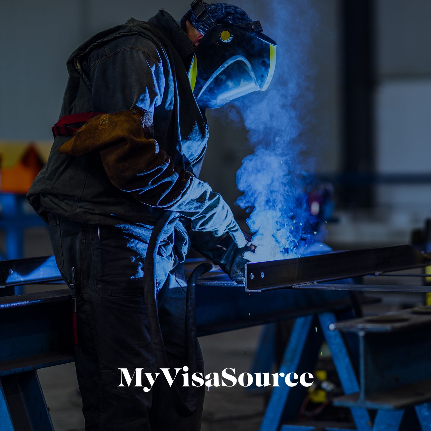 welder working on a metal beam my visa source