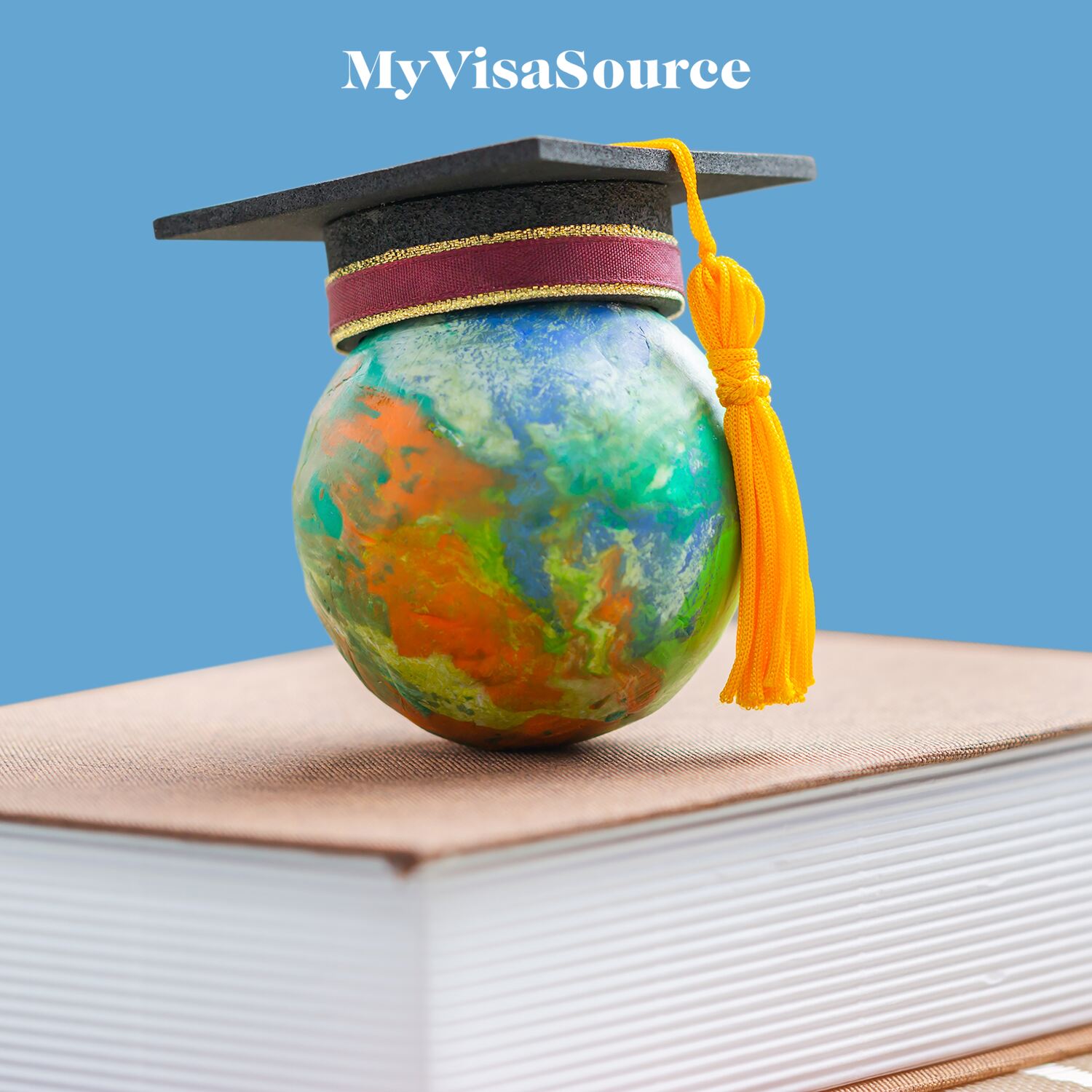 world-globe-with-a-graduate-hat-on-a-book-my-visa-source