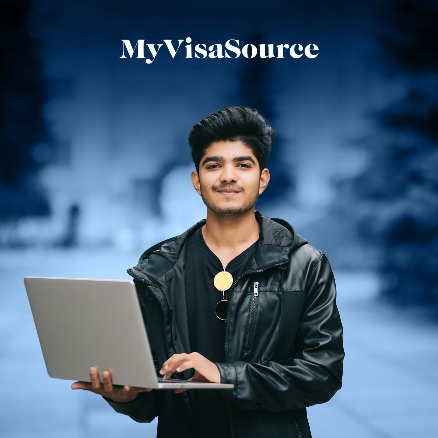 young east indian male student with a laptop smiling my visa source