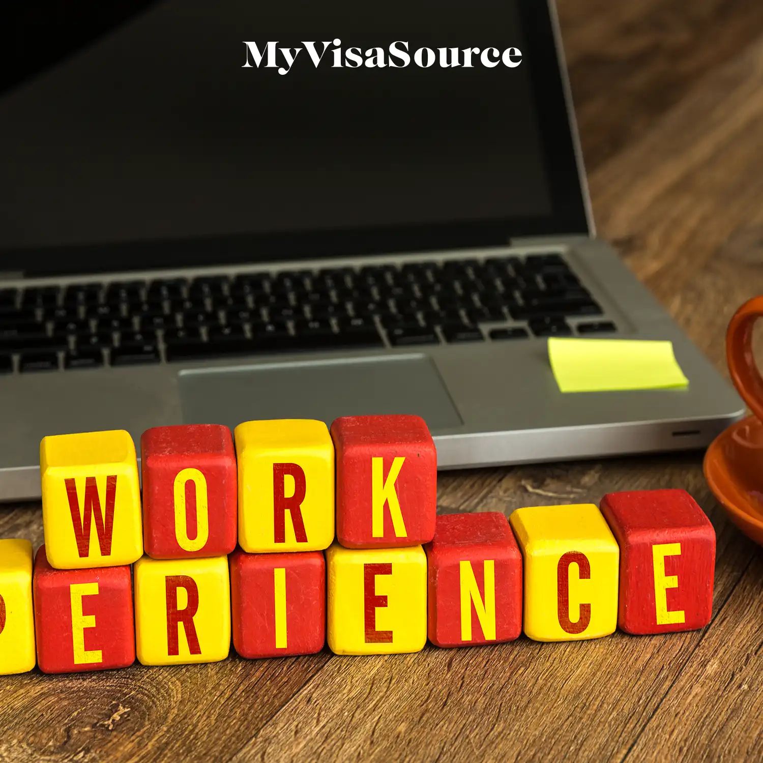 work experience spelled out in blocks in front of a laptop by my visa source