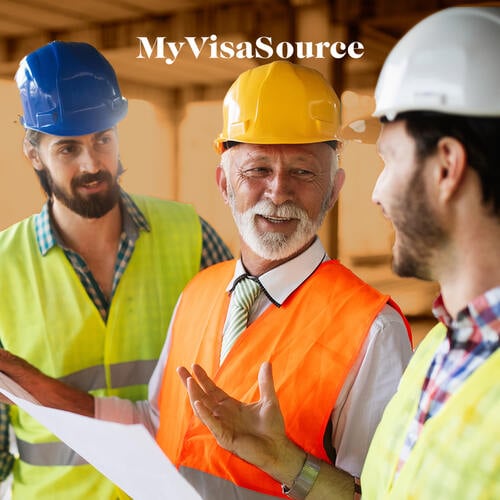 cheerful-construction-workers-discussing-work-my-visa-source