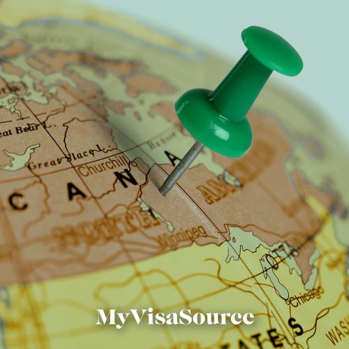 globe with a green pin on canada my visa source
