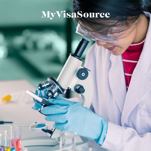 medical-technician-working-over-microscope-my-visa-source
