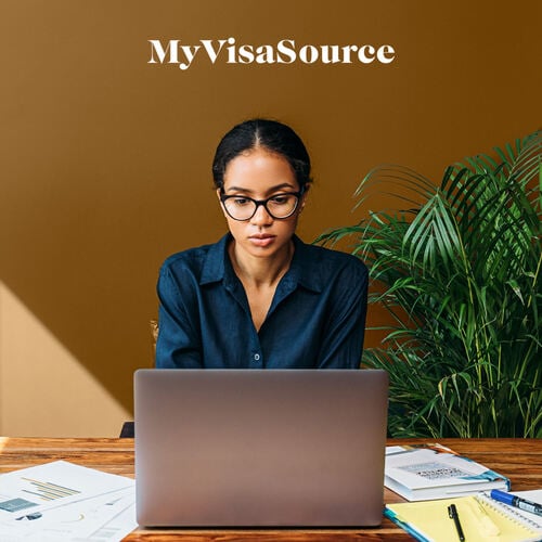 woman-working-at-desk-on-laptop-my-visa-source